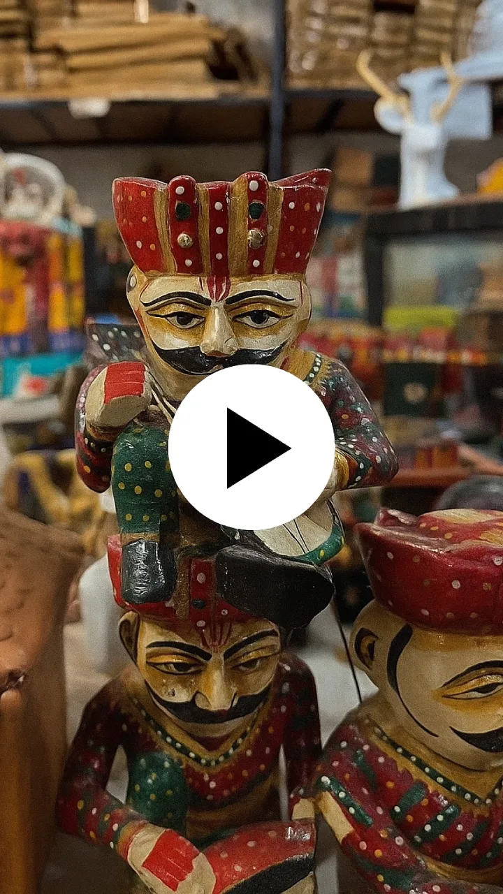 Colorful handcrafted Rajasthani sitting men figurines depicting traditional village musicians in ethnic attire